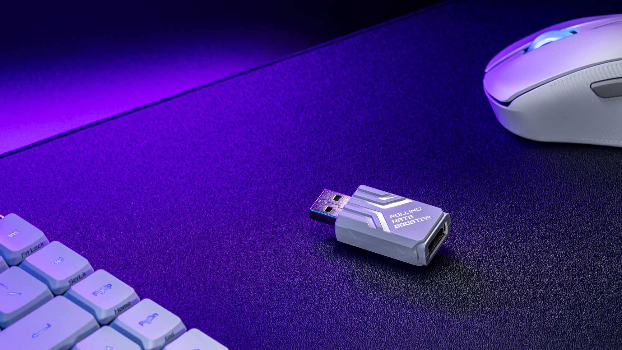 The ROG Polling Rate Booster next to the Keris II Ace mouse.